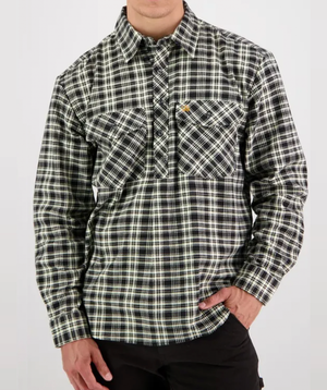 Wearing a Swanndri Egmont Flannelette Twin Pack shirt, 100% brushed cotton in black and white plaid with long sleeves and two chest pockets, the person stands against a plain background, left hand in pants pocket, face not visible.