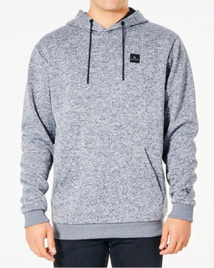 The person is wearing a light gray Rip Curl Anti Series Crescent Hood with black drawstrings and a small black square logo on the chest, featuring a marled texture and ribbed cuffs on the wrists and hem, against a plain background.