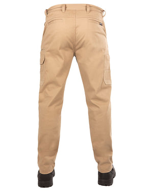 A rear view of a person wearing the UNIT Demolition Stretch Cargo Pant in beige and black shoes. The durable work pant features cargo-style pockets on both legs and belt loops at the waist. The person's legs are slightly apart, and the photo is taken against a white background.