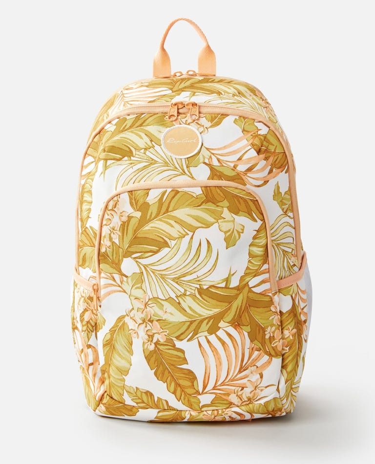 The Rip Curl Ozone 30L Multi Backpack features a tropical leaf and flower pattern in yellow, orange, and green on white. It includes adjustable straps, a front pocket, side pockets, and an insulated cooler compartment with contrasting peach zippers and trim.
