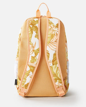 The Rip Curl Ozone 30L Multi Backpack in peach and white features a tropical leaf pattern, adjustable shoulder straps, a ventilated mesh back, and an insulated cooler compartment. A black label with text decorates the bottom strap of this stylish accessory.