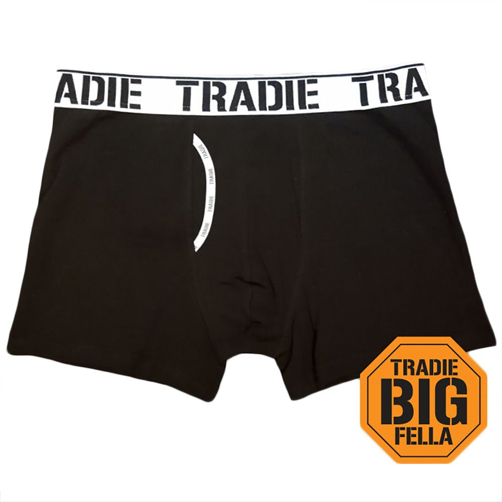 A pair of black men's boxer briefs with a white waistband displaying the brand "TRADIE" in repetition. Crafted from stretch material for a comfortable fit, they feature an orange emblem with the text "TRADIE BIG FELLA" on the bottom right corner. Perfect addition to your Tradie Big Fella ManFront Trunk collection.