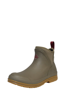 The Muck Boot Originals Women's Ankle Boot is olive green with a brown sole and red pull tab. It's waterproof, features an antimicrobial footbed, and has a small red logo on the front side against a white background.