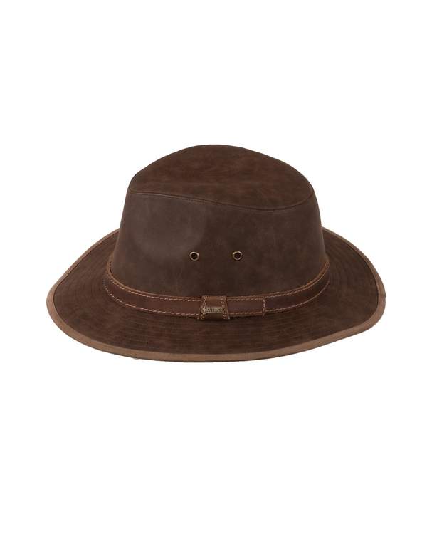 The Outback Raven Hat is a brown leather wide-brimmed hat with a slightly creased crown, featuring a simple hatband with a small buckle and two ventilation eyelets on each side. This comfortable hat also includes a moisture-wicking sweatband for added comfort.