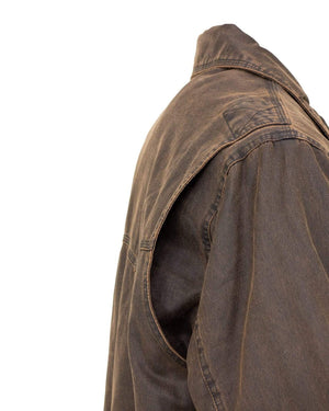 Close-up of the Outback Ranchers Jacket showcasing the shoulder and collar area. The brown, durable fabric appears slightly worn, giving it a rugged, vintage appearance. The visible stitching and seams highlight the jacket’s detailed craftsmanship and reveal a cozy polar fleece lining inside.