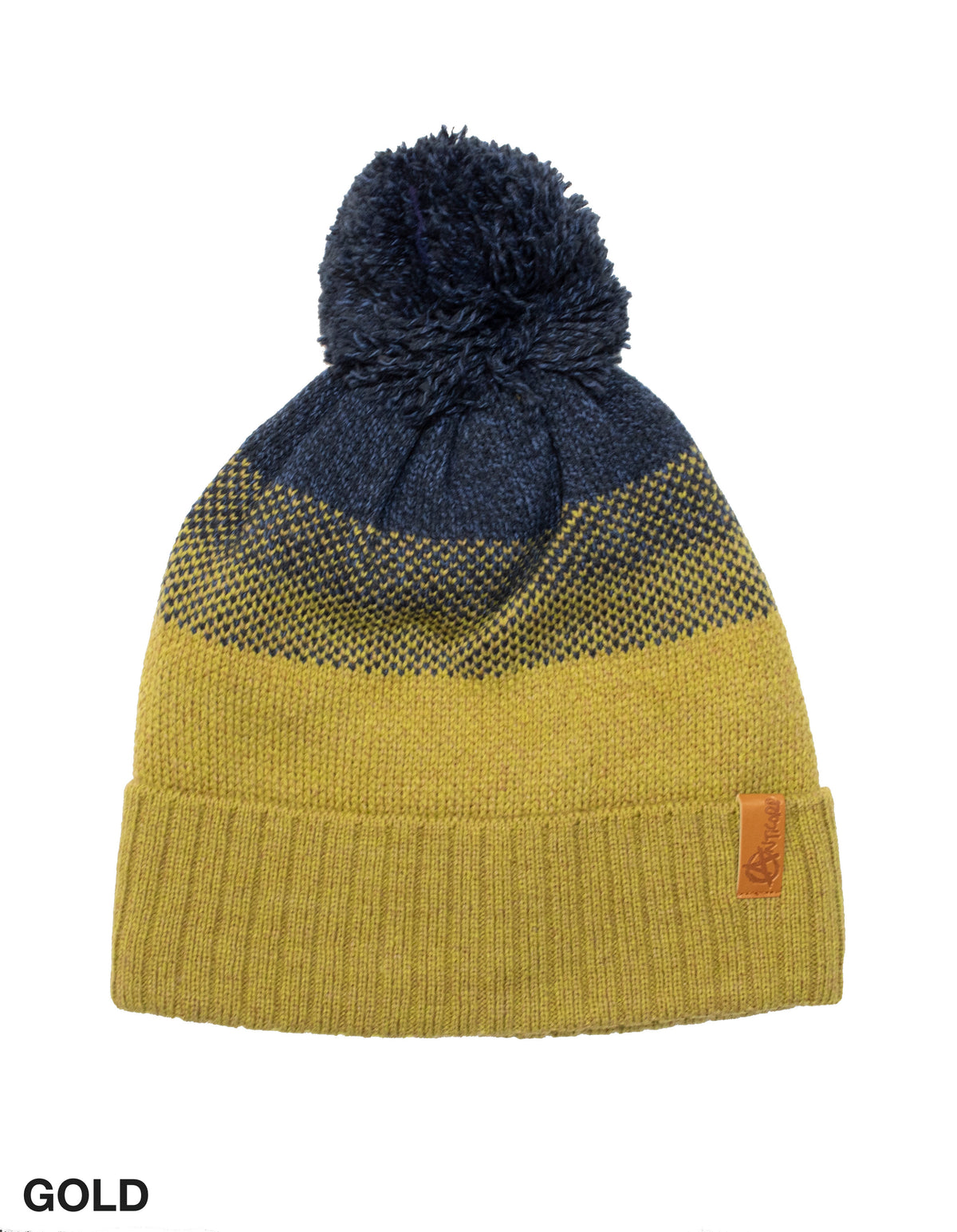 A cozy knit beanie with a large pom-pom on top, perfect for cold weather. This Anticorp Panel Beanie features a color gradient transitioning from gold at the bottom, through dark gray in the middle, to dark blue at the top. A small leather tag stitched on the folded brim reads "GOLD" in the lower-left corner.