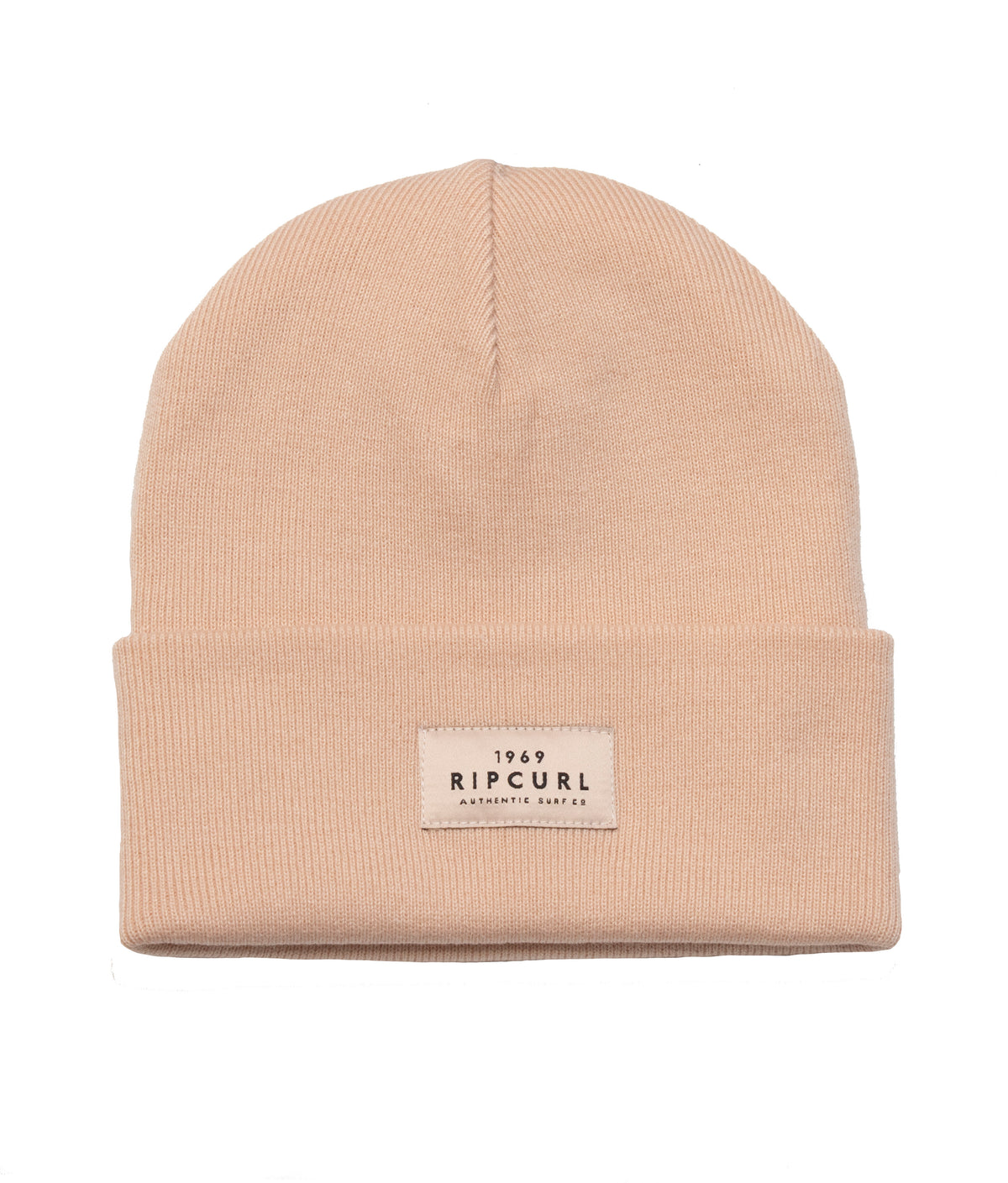 The Rip Curl Premium Surf Beanie is a beige rib knit hat with a folded brim, featuring a small rectangular patch on the front that reads "1969 RIP CURL, A PRODUCT OF THE SEARCH" in black lettering.