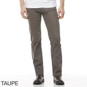 A person is wearing taupe-colored Riders Straight Moleskin Stretch pants with a white shirt. Only the torso and legs are visible. The person is standing with hands at their sides. Below the image, the word "TAUPE" is written in capital letters.