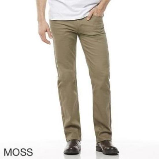 A person wearing stylish casual khaki-colored "Riders Straight Moleskin Stretch" pants, a white shirt, and brown shoes. The word "MOSS" is written in the bottom left corner, indicating the color of the lightweight moleskin pant. The person's upper body is not visible in the image.