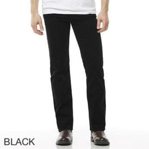 A person wearing Riders Straight Moleskin Stretch pants and brown shoes stands against a white background. The word "BLACK" is displayed in the bottom-left corner of the image. The person is wearing a white top, though it is only partially visible.