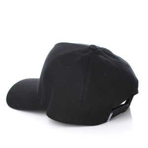 A Ringers Western Grover Baseball Cap is displayed from the back and side, resting on a white surface. This black cap features an adjustable strap with a snap closure.