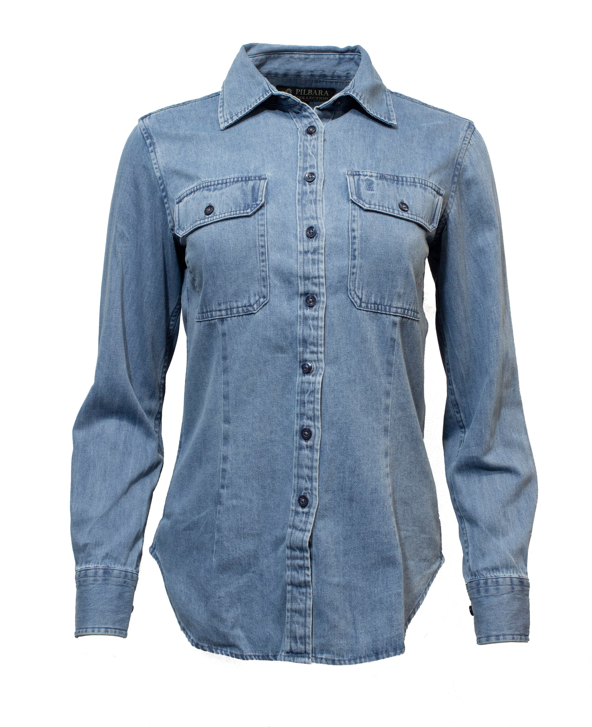 The Pilbara Ladies Denim Shirt is a long sleeve, 100% cotton garment in light blue, featuring a button-up front, pointed collar, and two chest pockets with buttons.