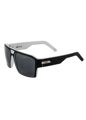 The UNIT Vault Eyewear offers a stylish design with a thick black front frame and contrasting white arms. The lightweight construction ensures comfort, while the dark-tinted lenses provide UV protection. Additionally, there's a small logo on both arms near the hinge.