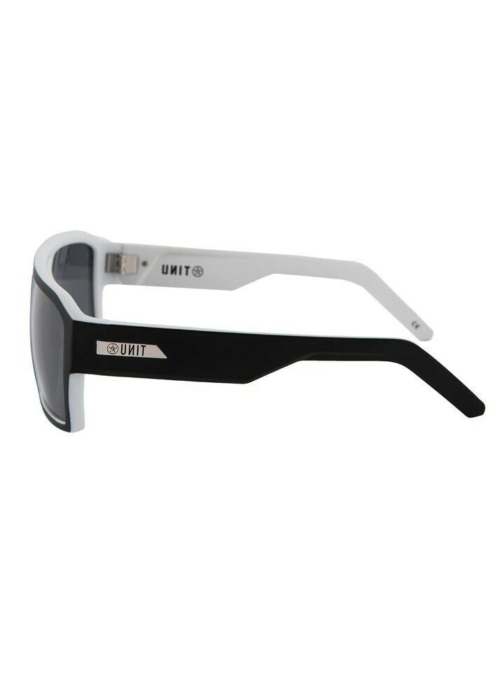 Side view of UNIT Vault Eyewear featuring a stylish black and white design. The sunglasses boast a lightweight frame and tinted lenses that offer UV protection. The temple arms are black on the outside and white on the inside, with the brand logo "ANTI" emblazoned in white on the sides.