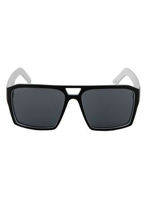 Introducing the UNIT Vault Eyewear: a pair of black rectangular sunglasses with dark lenses and sleek white temple arms. These lightweight frames feature a distinctive small triangular cutout above the nose bridge and provide UV protection for your eyes.