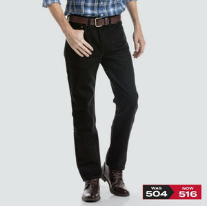 A person wearing a blue plaid shirt with rolled-up sleeves, a brown leather belt, black pants, and brown lace-up shoes. The 100% cotton Levis 516 Straight Jeans ensure a comfortable fit. A price tag graphic at the bottom right shows the price change from $504 to $516.