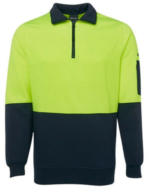 The JBs Hi Vis 1/2 Zip Fleecy is a long-sleeve workwear safety sweatshirt that boasts a high-visibility bright yellow upper half and a dark navy lower half. It features a half-zip collar and includes a convenient pen pocket on the left sleeve. Crafted from a durable polyester cotton blend, this sweatshirt ensures ultimate comfort and resilience.