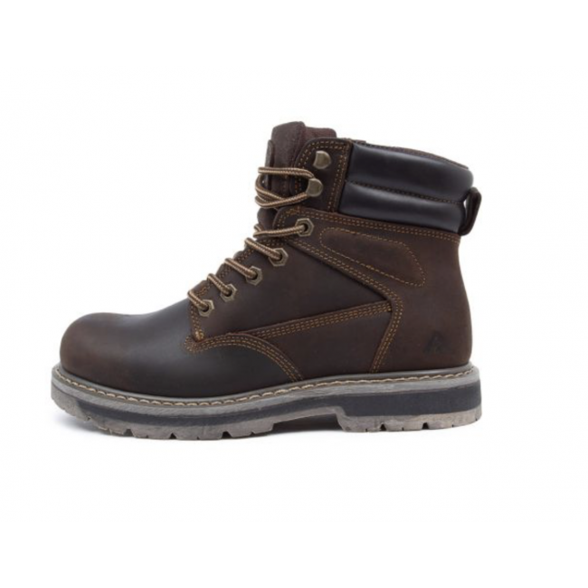 The Colorado Altitude Boot is a sturdy brown work boot characterized by tan stitching, a reinforced toe, and a thick, high-traction sole. It includes metal eyelets and rounded laces, along with a padded black collar and a pull-tab at the back for easy wearing. The leather construction guarantees classic durability perfect for heavy-duty use.