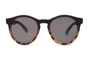 Meet the Liive Six Shooter Sunglasses, featuring tortoiseshell-patterned round frames with a sleek black top and dark lenses. Made from lightweight polycarbonate, they provide UV protection for a timeless yet contemporary look.