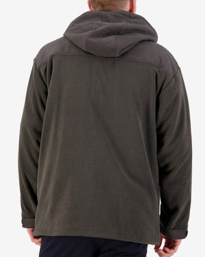 A person facing away from the camera, wearing the Swanndri Low Rock Hoodie in dark gray waterproof fabric. The hoodie features a slightly lighter gray panel across the shoulders and upper back. The individual is also sporting dark-colored pants, standing against a plain white background.