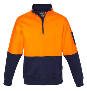 The Syzmik Hi Vis Half Zip Pullover is a high-visibility pullover sweater featuring a bold, bright orange top half and a navy blue bottom half. Made from a durable Polyester/Cotton blend, it includes a quarter-zip collar, spacious front pocket, and a small pocket on the left sleeve. Designed for safety and functionality in various work environments.