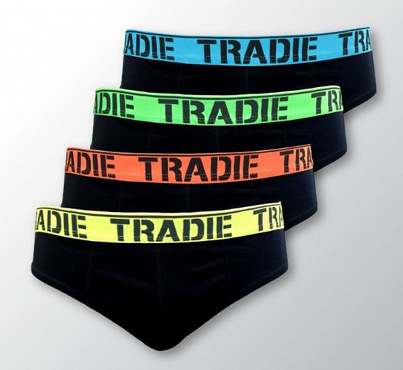 The Tradie Mens 4PK Brief features four pairs of black men's briefs organized in a cascading display, each adorned with a differently colored waistband emblazoned with the word "TRADIE." From top to bottom, the waistband colors are blue, green, orange, and yellow. They are crafted from 100% cotton for maximum comfort and feature soft elastic bands.