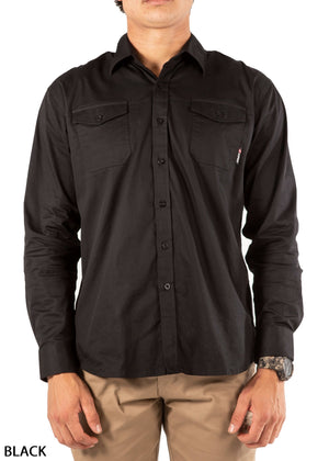 A man wearing the UNIT Craftman Stretch Shirt in black with two chest pockets and khaki pants stands against a white background. "BLACK" appears in the bottom left corner.