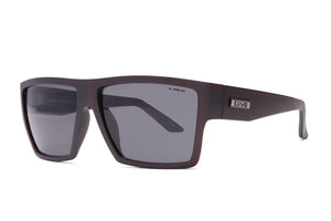 Rectangular, matte black Liive Volt Sunglasses featuring dark-tinted lenses. The frames are thick yet lightweight, made from durable polycarbonate and embellished with a metal "Live" logo on the arms near the hinges. These sunglasses boast a simple and modern design ideal for casual wear, providing reliable UV protection.