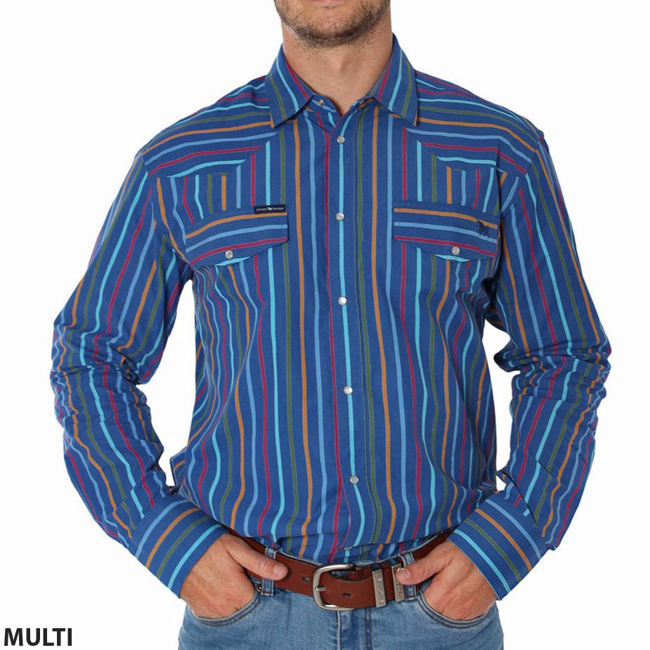 A person wearing the Ringers Western Wyoming Shirt, a 100% cotton, semi-fitted button-up with vertically striped patterns in blue, red, and yellow. The shirt features two breast pockets and is paired with blue jeans. The person's hands are in their jeans pockets. "MULTI" and "Ringers Western" appear in the bottom left corner.