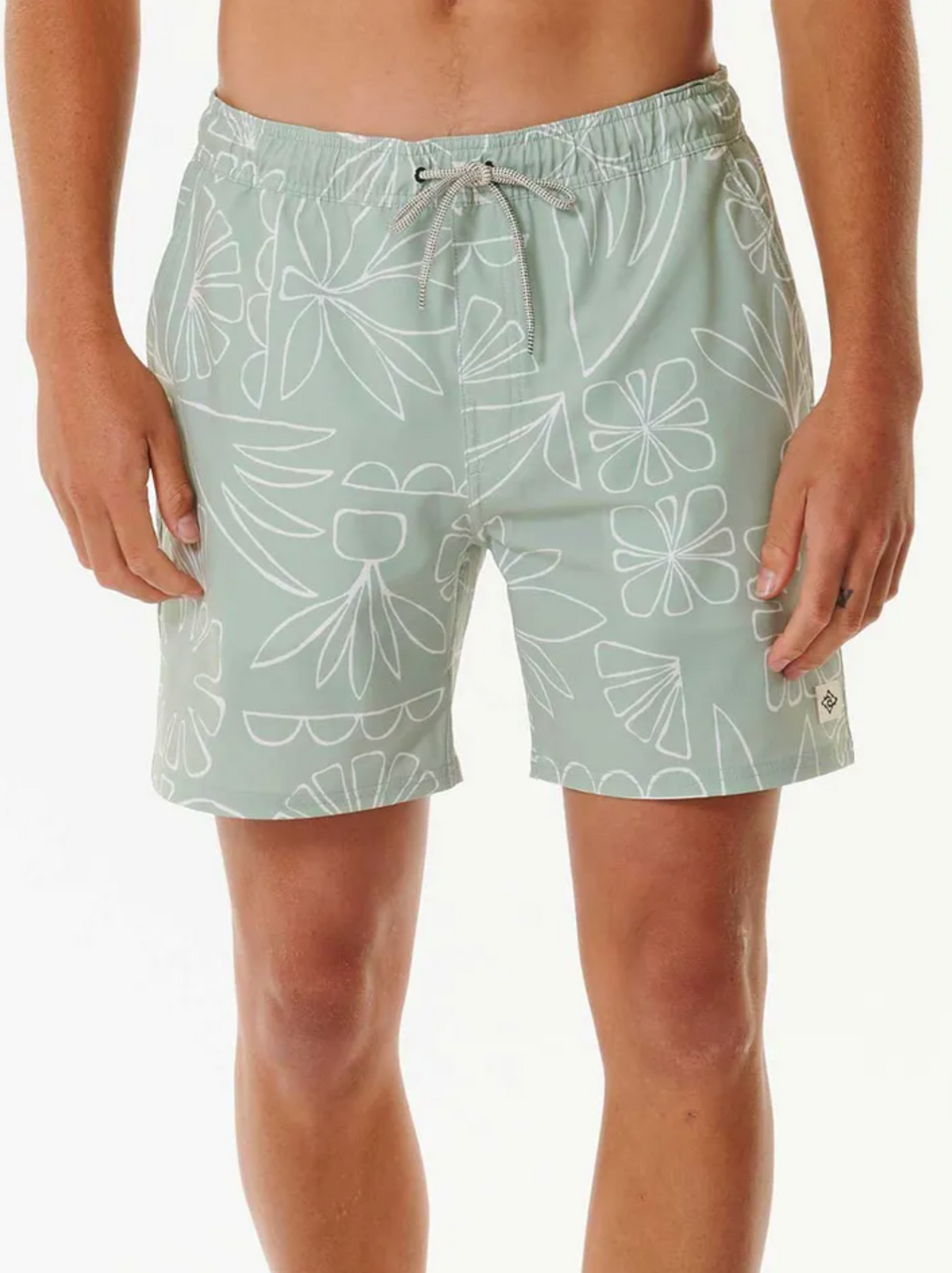 Sporting mint green Rip Curl SWC Plantation Volley swim shorts with a white abstract floral design, these trendy shorts offer an elastic drawstring waist for comfort. Made from quick-dry fabric, they're perfect against a plain white backdrop.