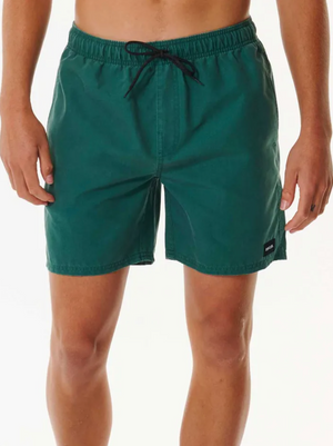 A person wears Rip Curl Bondi Volley dark green swim trunks with an elastic waistband, black drawstring, and a small black label on the left leg. Perfect for the beach, these shorts stand out against a plain white background.