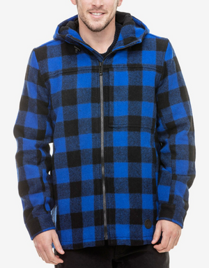 A man is wearing a Swanndri Hudson Hoody jacket in blue and black plaid. He is smiling with his hands relaxed by his sides. The background is plain white, drawing full attention to the New Zealand Wool jacket's distinctive checkered pattern.