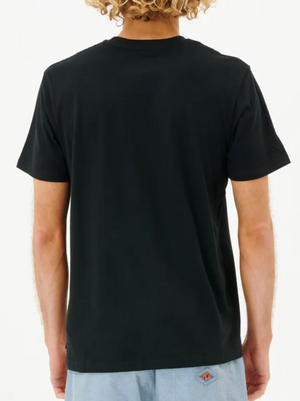 A person with curly hair is seen from behind, wearing a classic Rip Curl Plain Pocket Tee made of 100% cotton in black and paired with light blue shorts, set against a plain white background.