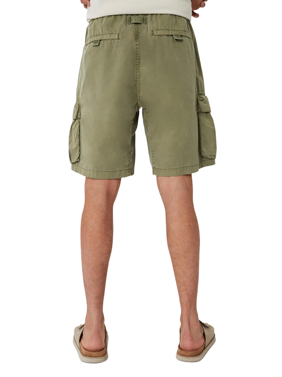 A back view features a person in olive green Industrie The Del Sur Combat Shorts, crafted from 100% cotton with multiple flap pockets. Paired with tan flip-flops, they stand against a clean white background.