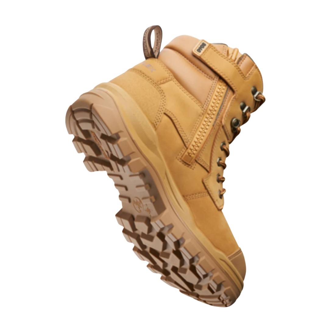 The Blundstone RotoFlex 8060 Unisex Zip Sided Safety Boot, featuring a single tan-colored design with a rugged outsole, metal eyelets, side zipper, and pull tab at the heel, is displayed against a white background. The water-resistant work boot appears to be durable and suitable for outdoor or heavy-duty work.