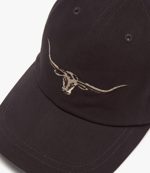 The RM Williams Longhorn Cap, made from cotton twill, showcases an embroidered longhorn steer skull on the front. It features a curved brim and visible stitching, embodying R.M.Williams' classic style.