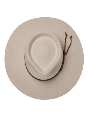 The Statesman Big Australian Fur Felt Hat is a wide-brimmed beige rabbit fur felt hat with a teardrop crown, viewed from above, and finished with a brown leather band featuring a decorative tie on the side.
