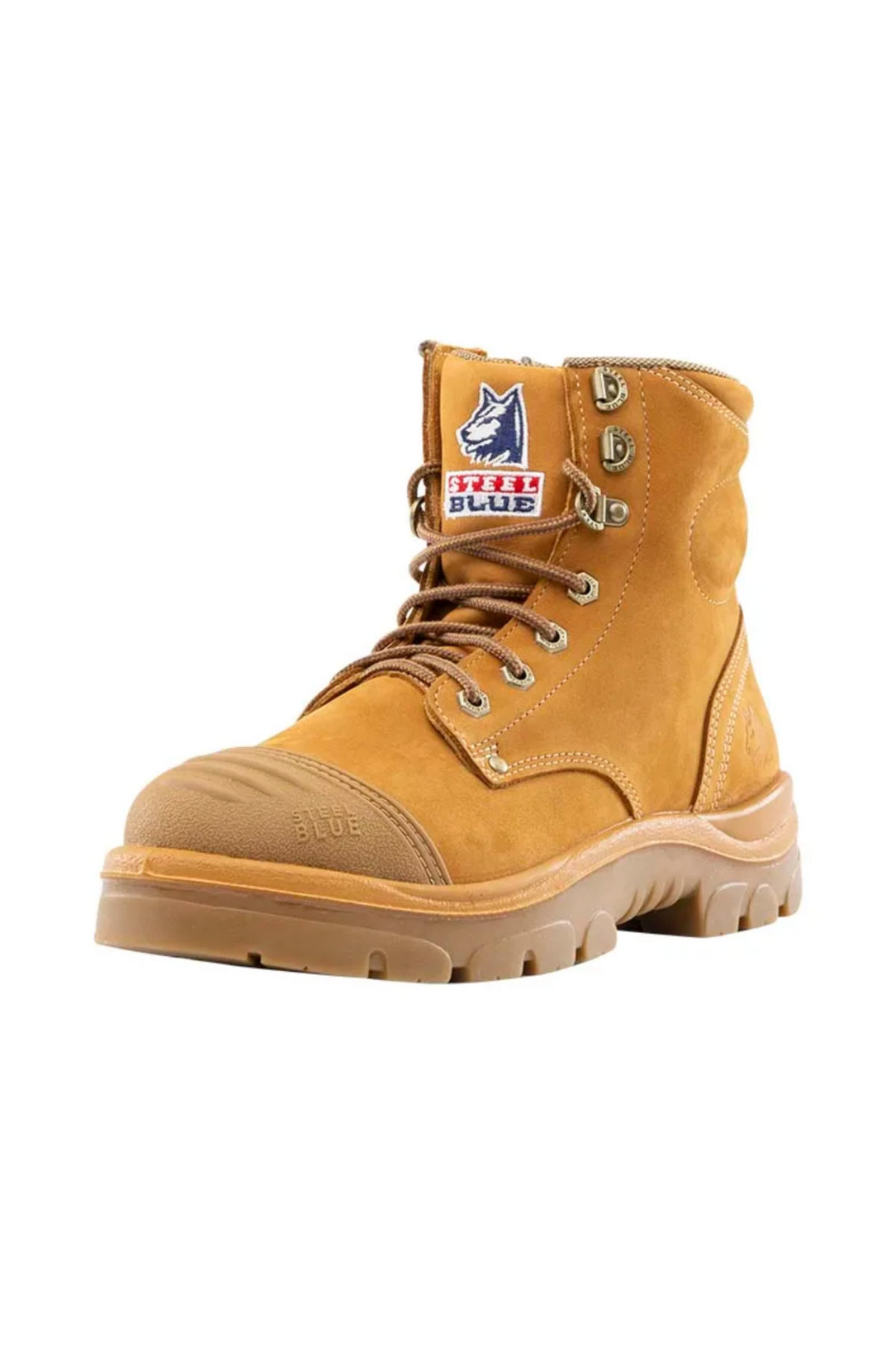 The Steel Blue Argyle Zip Scuff Cap Boot is a tan work boot designed for tough conditions. It features a thick rubber sole, metal eyelets with brown laces, and reinforced stitching. Made from water-resistant leather, this boot also includes a safety steel toe for extra protection. The tongue displays a patch with the logo of a wolf's head and the words "BLUE BLUE.