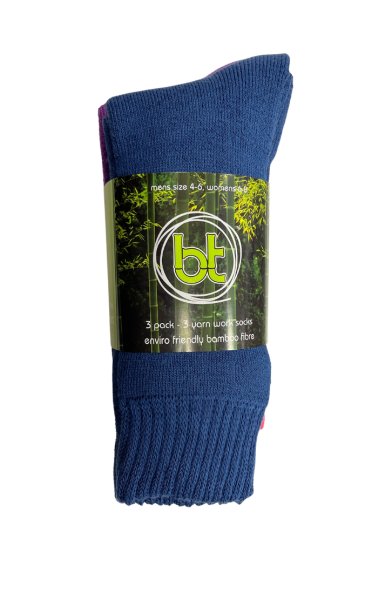A single pair of folded blue Bamboo 3 Yarn 3 Pack Work Socks is shown with a green and black label. The label includes the brand logo "bt" and mentions the socks are men's size 6–10, made from a wool blend with anti-bacterial fabric, and are environmentally friendly. They also provide excellent blister protection.