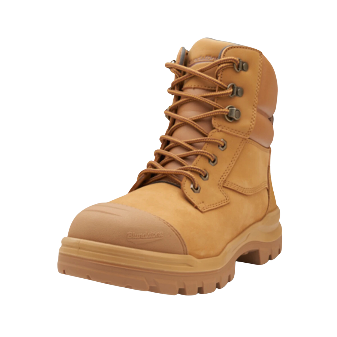 The Blundstone RotoFlex 8060 Unisex Zip Sided Safety Boot showcases a single tan work boot with sturdy construction. It features a thick rubber sole, metal eyelets, and brown laces, along with a padded collar and prominent stitching details. This water-resistant boot has the brand name imprinted on the toe area for added style and authenticity.