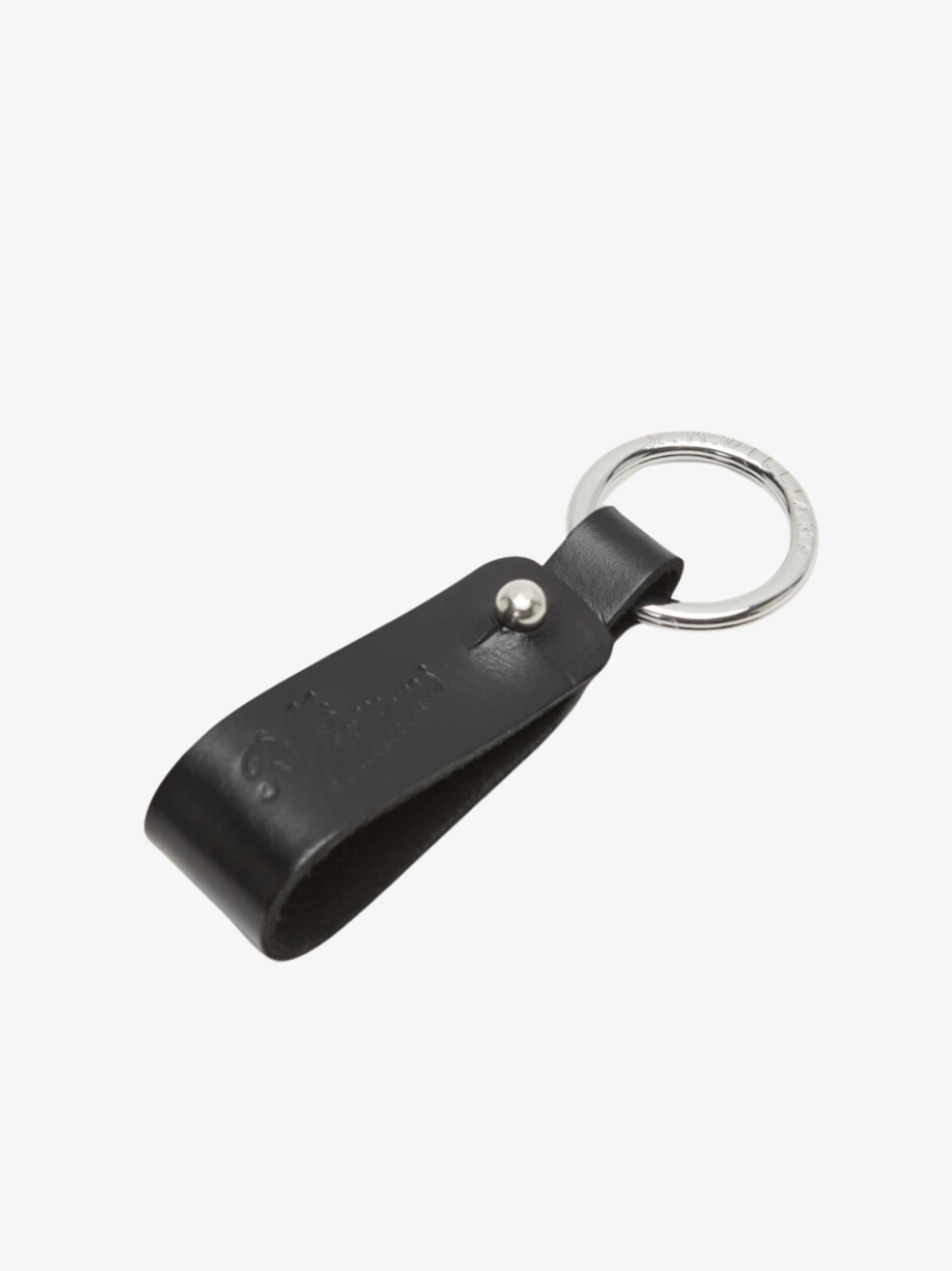 The RM Williams Pioneer Key Fob is a black leather key fob with a loop design, attached to a sleek silver metal ring. Made from double butt leather with nickel hardware and subtle embossed text, it exudes understated elegance against a plain white background.