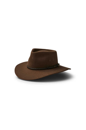 The Akubra Cattleman is a brown felt hat with a wide brim, creased crown, and braided hatband—ideal for outdoor adventurers. Shown on a white background.