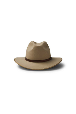 The Akubra Coober Pedy is a beige wide-brimmed cowboy hat with a brown band, shown against a white background with a soft shadow—ideal for embracing Australian style.