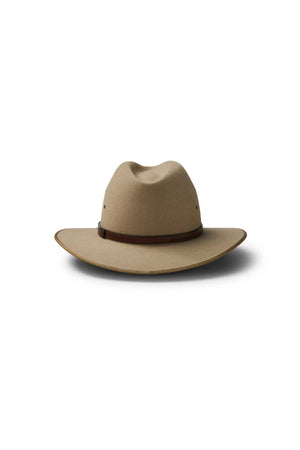 The Akubra Coober Pedy: a tan wide-brimmed hat with a creased crown and dark brown band, showcased on a white background—an iconic Australian style statement.