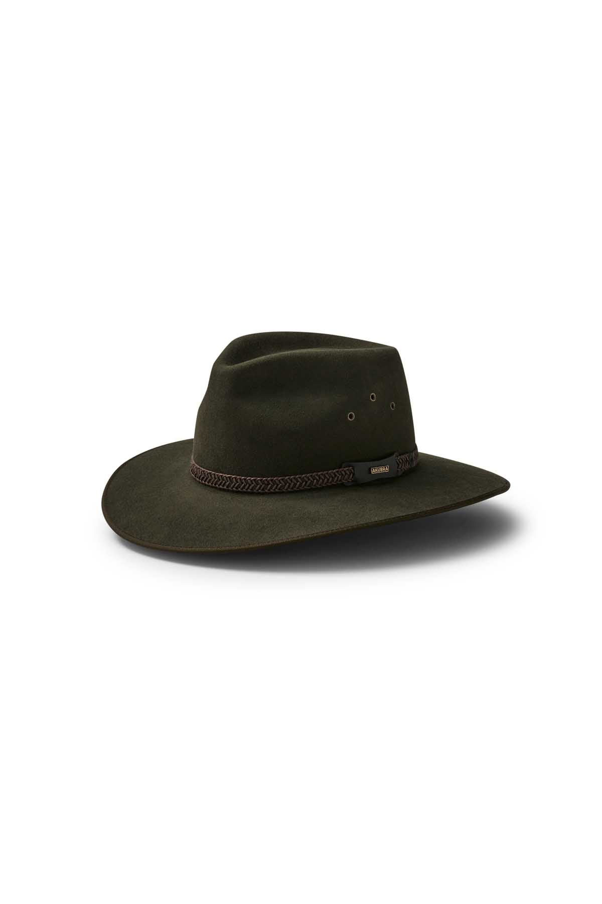 The Akubra Tablelands is a dark brown wide-brimmed hat with a creased crown, braided band, and metal eyelets on the side, combining practicality and style against a white background.