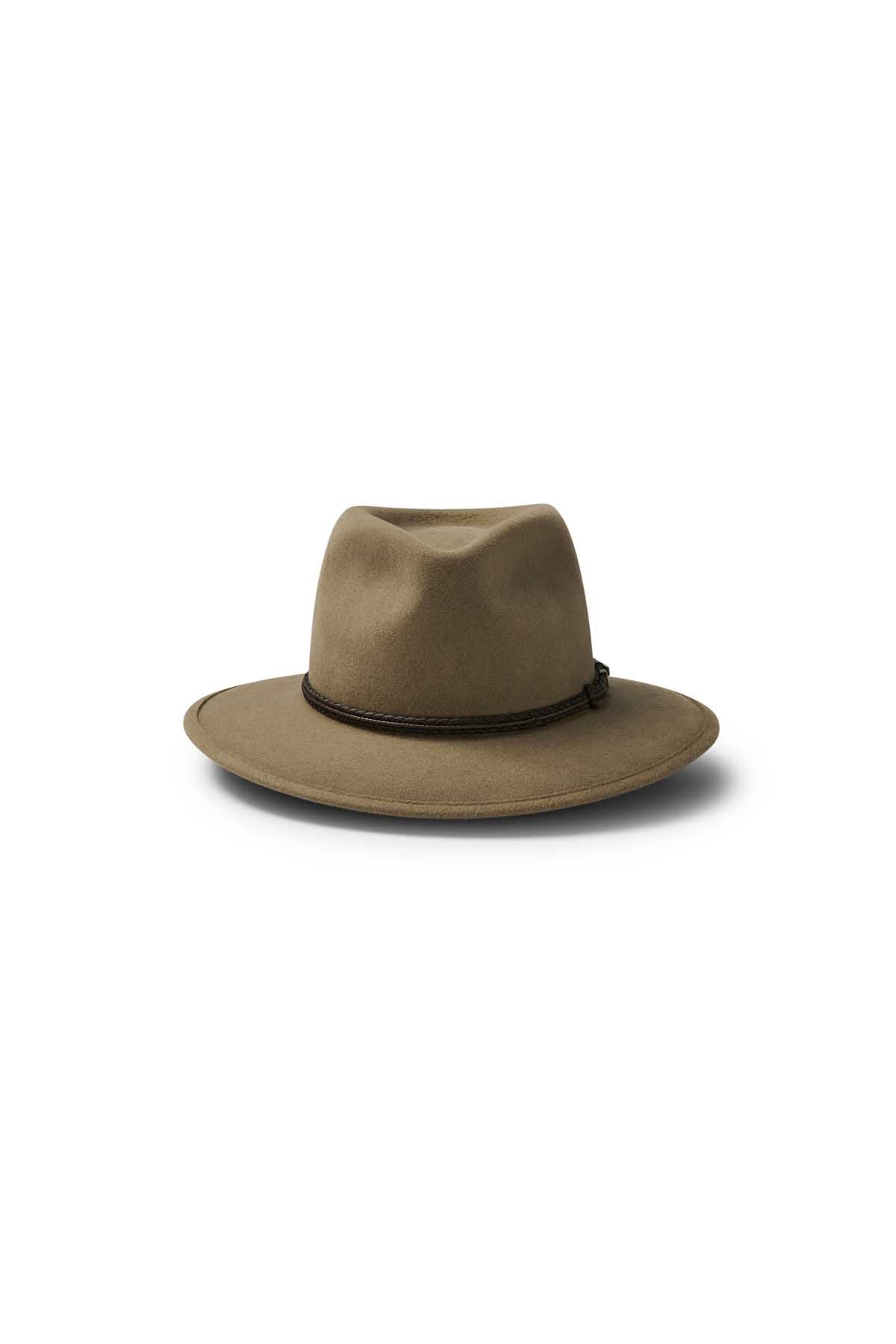 The Akubra Traveller is a brown felt hat with a pliable structure, wide brim, pinched crown, and thin dark band at the base, shown on a white background.