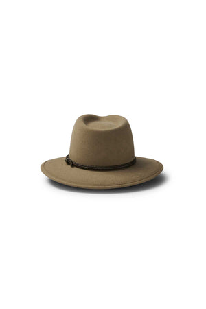The Akubra Traveller is a light brown, wide-brimmed hat with a simple braided dark brown band and a flexible felt structure, shown on a white background.