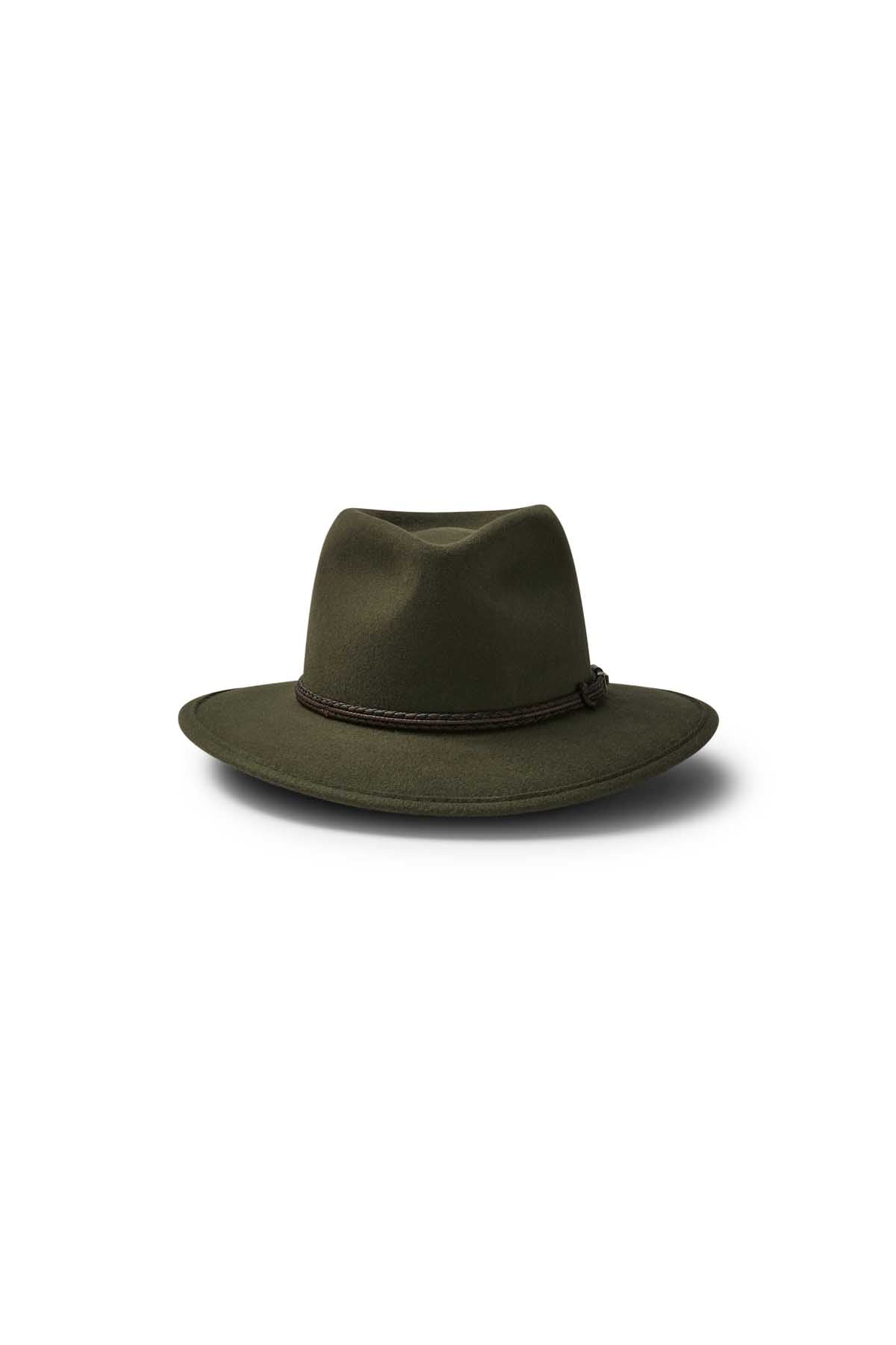 The Akubra Traveller is a dark green hat with a wide brim and black leather band, crafted from felt for adventurers, shown on a plain white background.