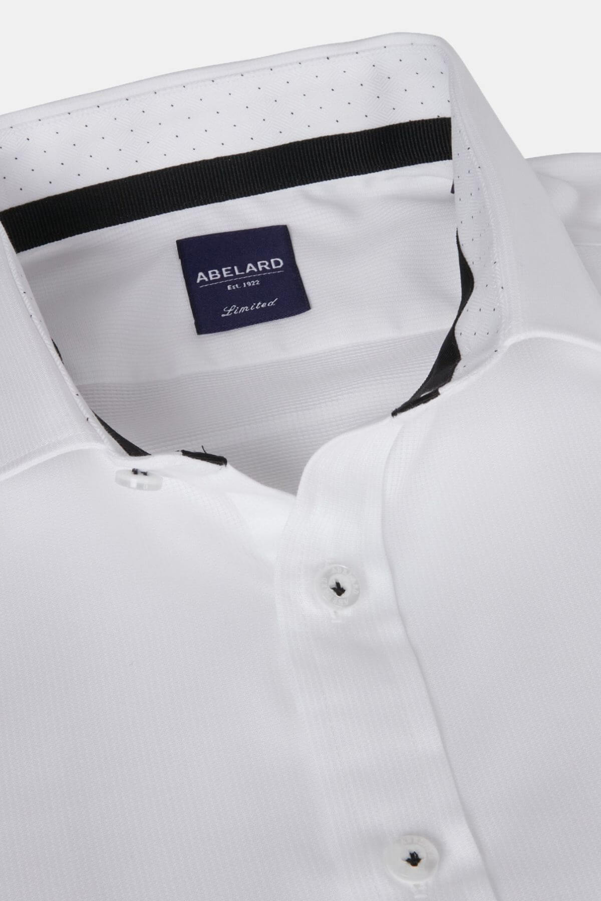 Close-up of the Abelard Bedford Dobby Slim Fit Shirt, made from 100% cotton with black buttons and a dark blue "Abelard Limited" label inside the collar. Features a subtle dotted pattern on the inner cardinal cut away collar lining.