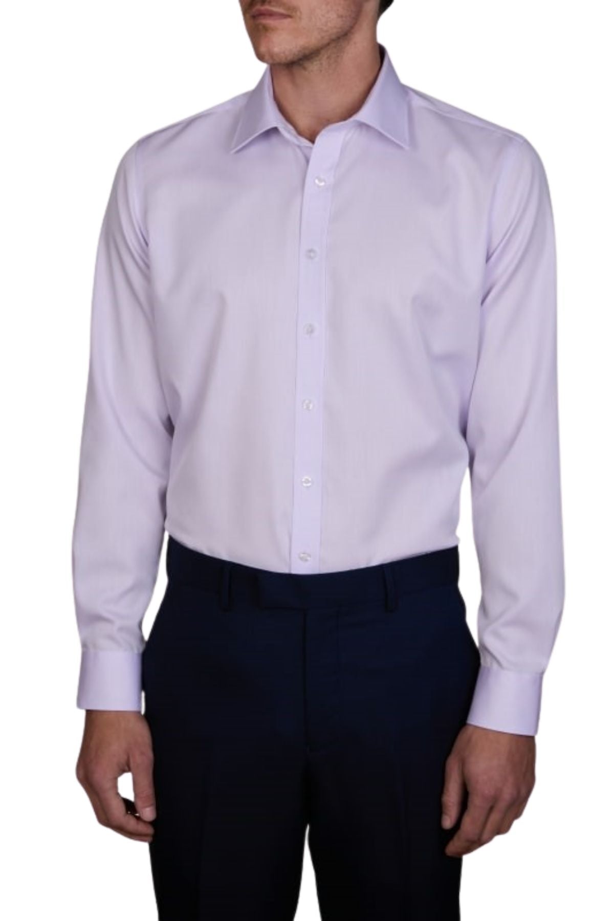 A man models the Abelard Non Iron Cotton Twill Slim Fit Shirt in light purple, featuring a cutaway collar. He stands in dark pants with relaxed arms, facing slightly left, his head partly visible against a plain white background.